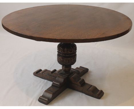 A Titchmarsh & Goodwin period-style oak table, 20th Century
The circular top raised on a vine and grape carved and chisel car