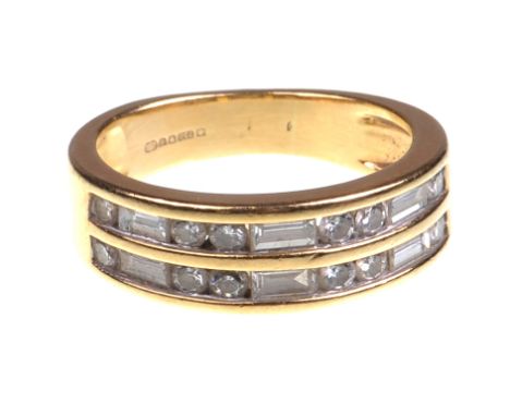 A 18ct gold diamond set half hoop dress ring
Having two rows of alternatively set round brilliant and baguette cut diamonds t