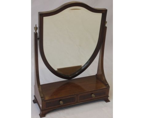 An Edwardian Sheraton-Revival mahogany dressing table mirror 
The bevelled shield shaped swing mirror between twin uprights c