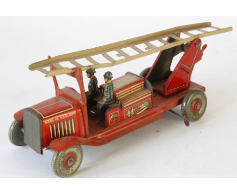 A tinplate clockwork fire engine possibly by Mettoy
Red with tin printed detail with two fireman, figures a ladder excluding 
