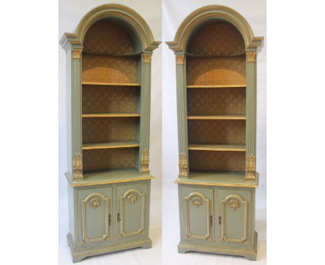 A pair of grand and ornate period-style tall wall cabinets, 20th Century
Each decorated with parcel gilt over a pale green gr