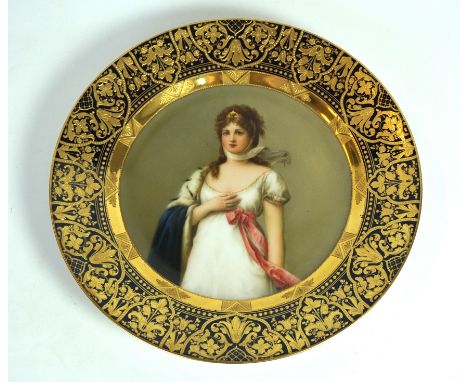 A 19th Century Vienna porcelain plate by Wagner
Of circular form, the central field finely painted with a half length portrai