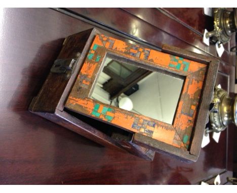 Additional Lot 
An interesting Indian provincial team and painted vanity box, the hinged lid opening to reveal mirror on ease