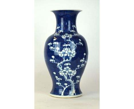 A Chinese Kangxi style 'Prunus' vase, 19th/20th Century 
Of baluster form, raising to a flared rim, the rich cobalt ground, p