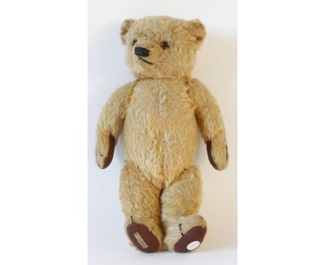 A Chad Valley Hygienic Toys gold plush teddy bear
With glass button eyes and articulated limbs, height 36cm. 