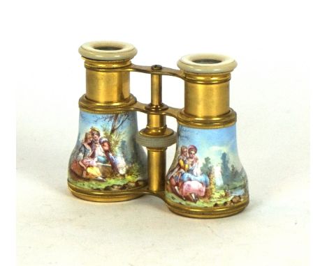 A pair of early 20th Century hand painted opera glasses, possibly French
Having enamel decoration depicting lovers seated in 