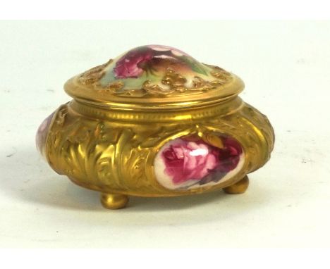 A Royal Worcester hand painted and gilt decorated lidded trinket box 
Of circular form, painted with roses surrounded by gilt