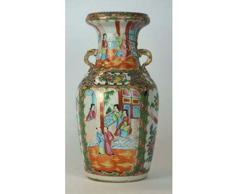 A Chinese Canton famille rose vase, early 20th century 
Of ovoid form, rising to a folded upper rim, and flanked by twin soli