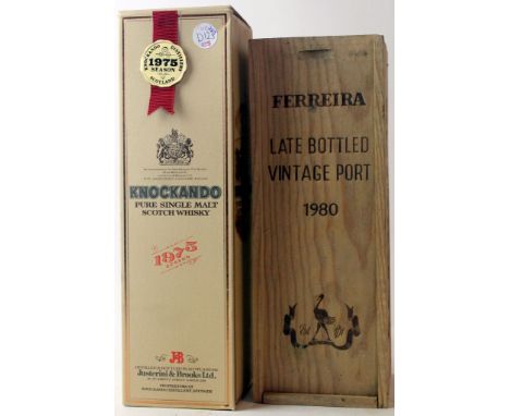 1 bottle Knockando Pure Malt 1975 
Season (bottled 1988) in Presentation Tube together with 1 bottle Ferreira Late Bottled Vi