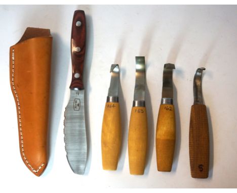 A collection of survival knives
Early 21st Century, comprising two short bladed knives with wooden handles complete with scab