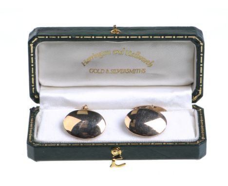 A pair of 9ct gold chain link cufflinks
Each having twin plain oval plaques with chain links, 12.6gms gross.