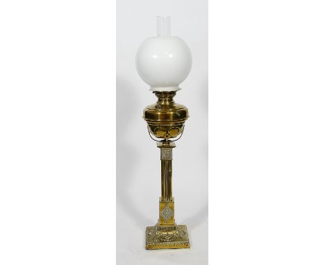 A late 19th/early 20th Century brass paraffin lamp
Having cylindrical reservoir, raised on a Corinthian column support, havin