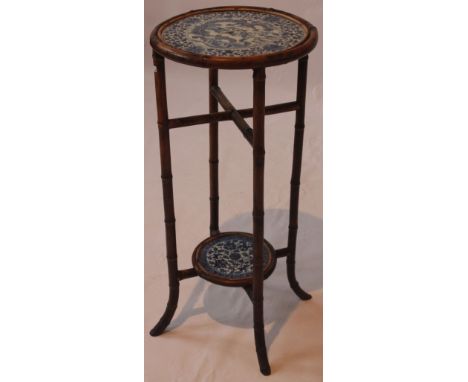 A Chinese bamboo occasional table, 19th/20th Century
The tall slender table, inset with a Kangxi style circular blue and whit