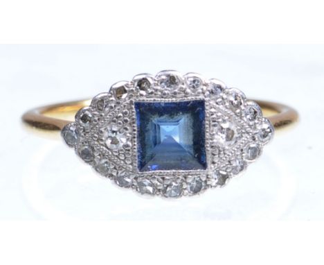 An Art Deco style sapphire and diamond set cocktail ring, circa 1930
The central square step cut sapphire within a lozenge pl