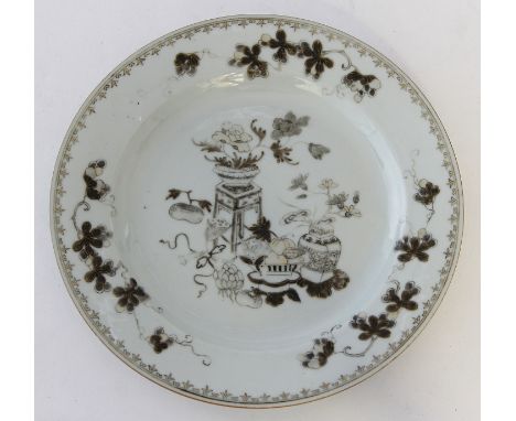 Two Chinese export porcelain dishes
The first an 18th Century en grisaille example, the monochrome design depicting precious 