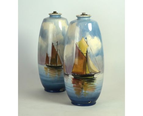 A pair of Minton hand painted cylindrical vases 
Depicting sailing vessels in landscape, impressed factory marks to base (con