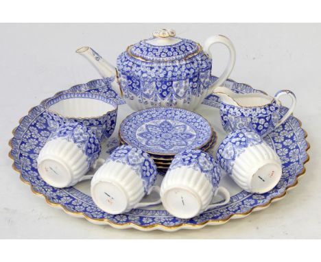 A 19th Century Coalport blue and white tea service
Comprising teapot, cream jug, sugar bowl, four cups, four saucers each hav