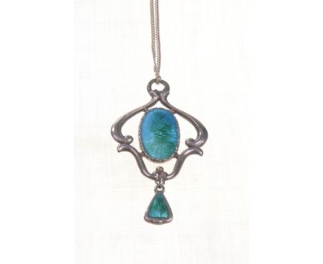 An Arts and Crafts silver and enamelled pendant by Charles Horner
The central enamelled roundel within stylised openwork fram
