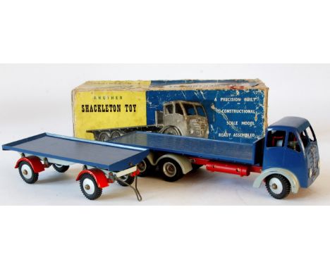A Shackleton Foden FG flatbed lorry 
Dark blue cab, flatbed, grey wheel arches, red chassis, together with trailer with dark 