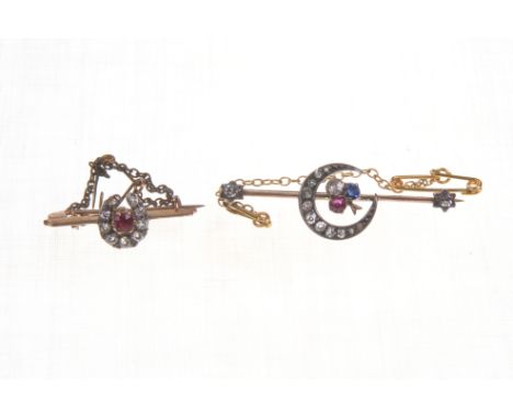 Two early 20th Century gem set bar brooches
The first with a central shamrock motif set with a round cut diamond, ruby and sa