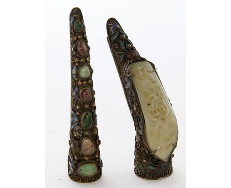 Two Chinese filigree silver and jade inset finger guards, circa 1920
Each of the tapered guards adapted to a brooch, inset wi