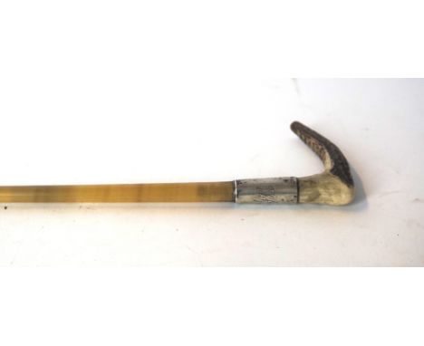 A late Victorian horn handled possibly rhino horn swagger stick
With hallmarked silver mounts for London 1891, length 65cm. C