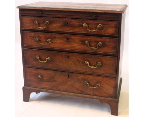 An early George III mahogany bachelors chest
The cross banded rectangular top with moulded borders, above the brushing slide 
