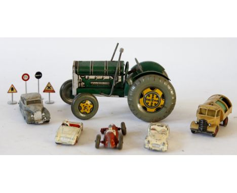 A group of tinplate and diecast vehicles / accessories
Comprising an unboxed Mettoy "UK" tinplate clockwork tractor in green 