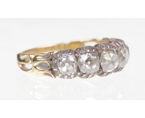A diamond set five stone ring, mid 19th Century
The five graduated cushion old cut diamonds claw set to fancy shoulders and p
