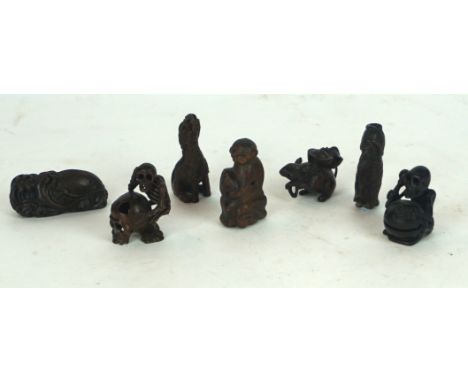 A collection of 20th Century Japanese carved hardwood netsuke
Including two carved as a skeleton 4.5cm and 5cm high, a tanuki