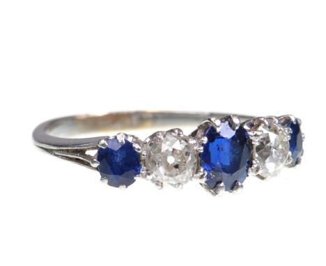 An early 20th Century sapphire and diamond set ring
Set with three sapphires interspaced with two old cut diamonds, to trifur