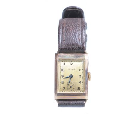 A mid 20th Century 9ct gold manual Tank wristwatch
The square gold tone dial with Arabic numerals, outer minute track and sub