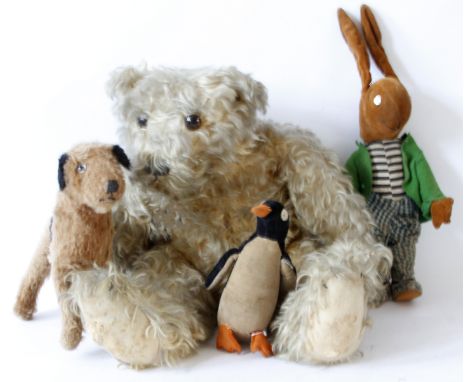 Six animal figures by various makers
Including plush leopard with green glass button eyes, black and tan plush dog with glass