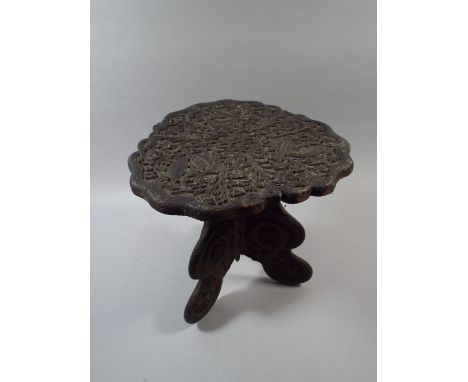 An Anglo Indian Tripod Table with Carved Decoration of Birds and Snakes. 