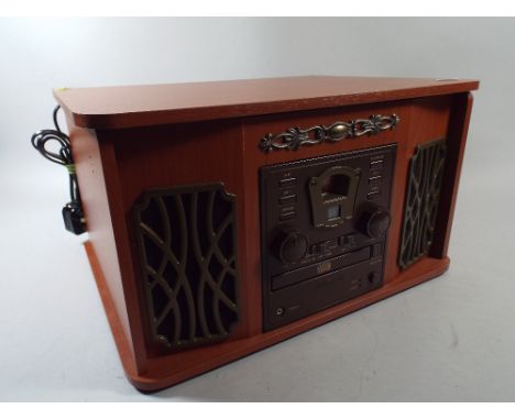 An Akura Retro Music Centre Radio CD Tape and Record Player. 