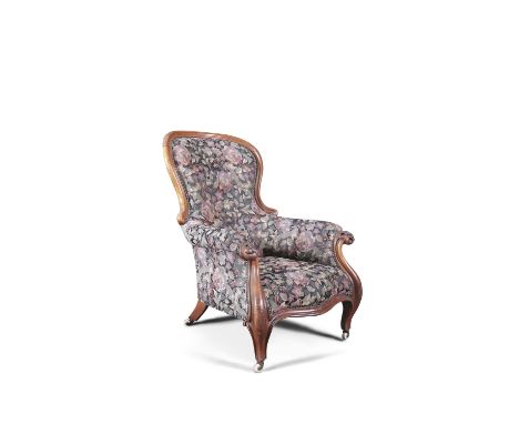 A LARGE VICTORIAN MAHOGANY FRAMED GENTLEMAN'S UPHOLSTERED ARMCHAIR, covered in foliate pattern tapestry cloth, raised on cabr