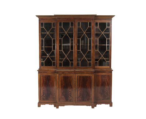 A MAHOGANY RECTANGULAR BREAKFRONT BOOKCASE IN THE GEORGIAN TASTE, with moulded cornice above four astragal glazed panel doors