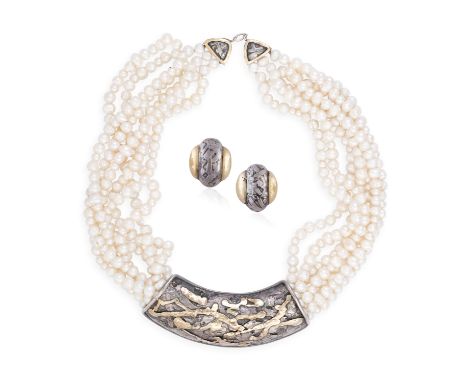 A SILVER AND FRESHWATER PEARL SUITE BY EILEEN COYNE, comprising necklace and earclips en suite, the necklace composed of seve