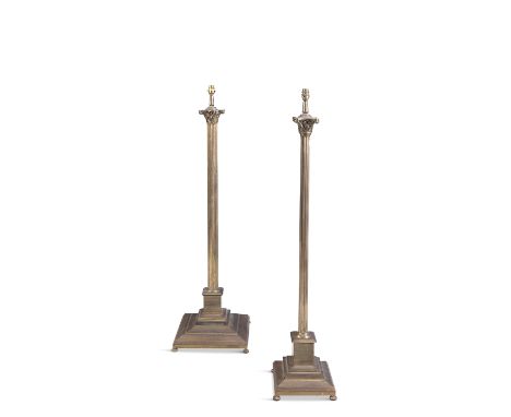 A BRASS FRAMED STANDARD LAMP, of Corinthian column design, with foliate cast capital and fluted column and squared base; toge