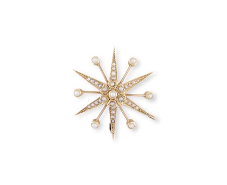 A GOLD AND SEED PEARL STAR PENDANT/ BROOCH, designed as a radiating star with knifewire bars, the centre containing a foliate