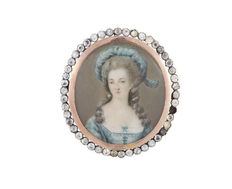 A VICTORIAN MINIATURE PORTRAIT BROOCH, the oval painted portrait of a lady contained within a paste surround, length 5cm