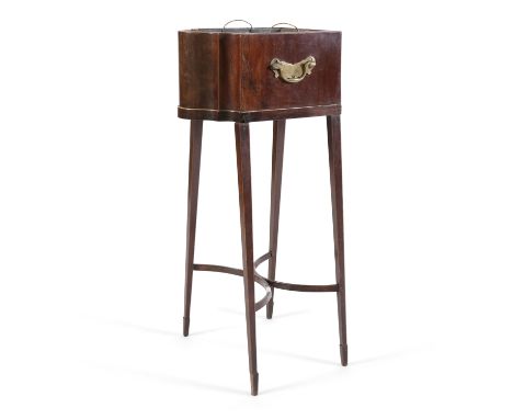 A GEORGE III MAHOGANY JARDINIERE ON STAND, converted from a knife box, of serpentine shape, with brass bracket side handles a