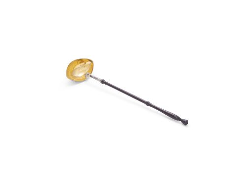AN IRISH PROVINCIAL BRIGHT CUT SILVER PUNCH LADLE, mark of Michael McDermott, Cork, with gilded bowl and turned walnut handle