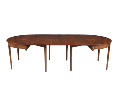 A MAHOGANY D-END DINING TABLE, the plain top above a moulded frieze, raised on square tapering legs, the rear gate legs suppo