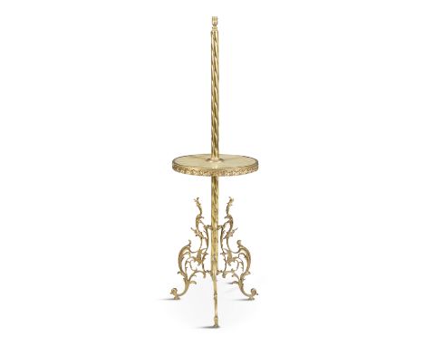 A GILT BRASS AND ONYX STANDARD LAMP, c.1930, fitted with shade the spiral column with an onyx mid-tier and supported on leaf 