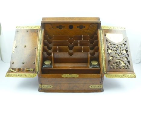 A LATE VICTORIAN WALNUT TABLE TOP WRITING BOX the two door sloping front, with engraved brass decorative hinges, mounts and r