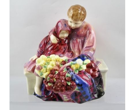 A ROYAL DOULTON FIGURE GROUP "Flower Seller's Children", depicting a young boy and girl sitting on a bench selling flowers fr