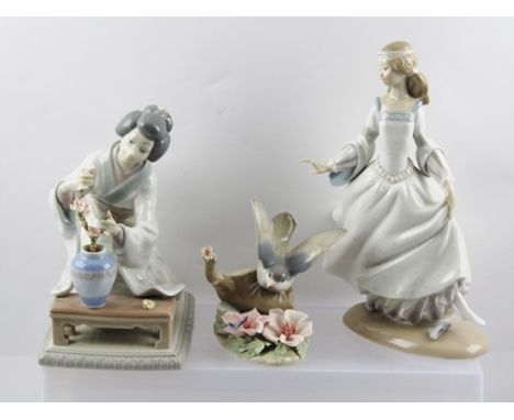 THREE LLADRO PORCELAIN FIGURINES, includes Japanese Bijin flower arranger, kneeling at a low table, 19cm high, together with 