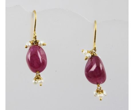 A PAIR OF VICTORIAN STYLE POLISHED RUBY AND SEED PEARL EARRINGS on wire fittings 
