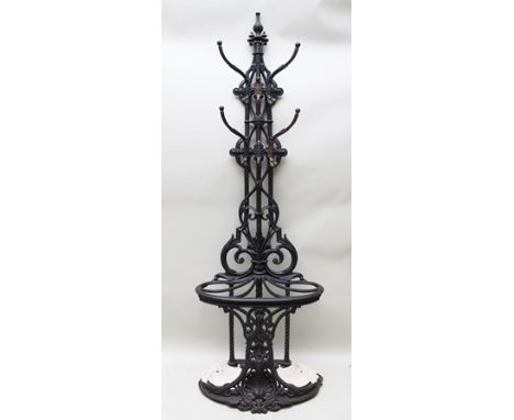 A 19TH CENTURY COALBROOKDALE CAST IRON HALL STAND, having ornate scrolling central upright, on a kidney shaped base with late